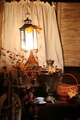 Samovar with a cup of tea. / Cup of tea and a Russian samovar under the light of a lantern. Autumn.