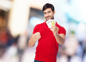 chinese man holding poker cards