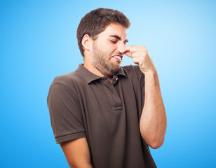 portrait of young man smelling closeup photo