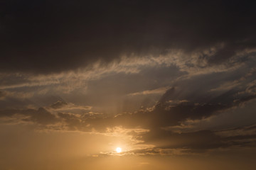 Fototapeta na wymiar sunset sky background, light rays of sunbeam in evening