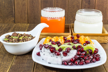 Homemade Chocolate Granola with nuts, mix fruits, Milk and Carrot juice, Healthy food.