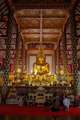 Fototapeta na wymiar golden buddha statue in wat suan dok temple, chiang mai