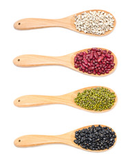 Job's tears, Kidney beans, Mung beans and Black beans with wooden spoon isolated on white.