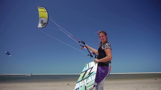 Young kiteboarder flying a kite