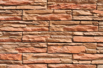 Wall made of layers of red slate.