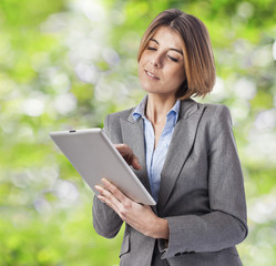 Fototapeta premium beautiful young business woman using her tablet
