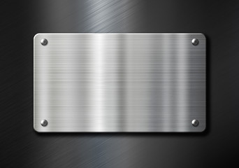 stainless steel metal plate over black background