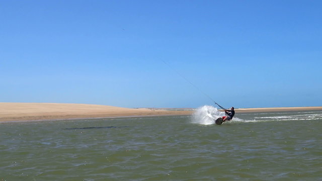 Kiteboarder jumps and crashes