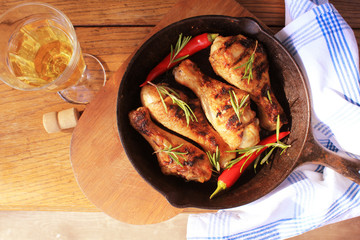 Grilled chicken legs in pan