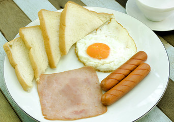 Breakfast set on wooden table background