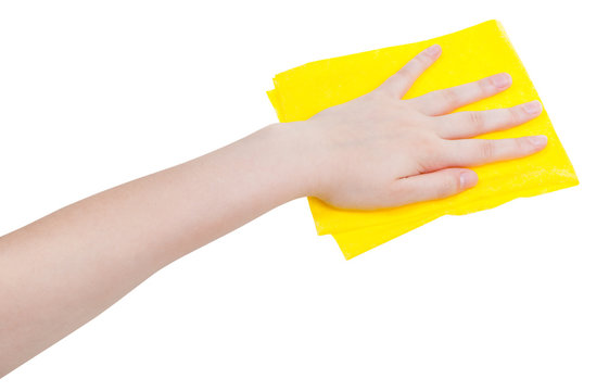 hand with yellow wiping rag isolated on white