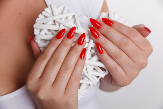 Closeup of a woman hand with red nails