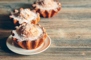 Large muffins on the table. Toned.