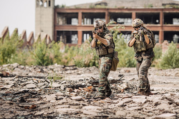 Private Military Contractor on patrol in destroyed city
