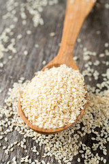sesame seeds on wooden surface