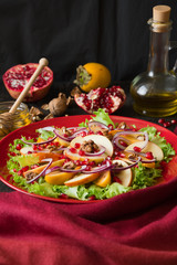 Fresh fruit salad with persimmons and garnet