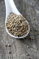 hemp seeds on wooden surface
