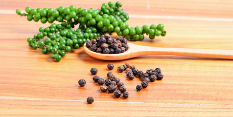 Black pepper on white background