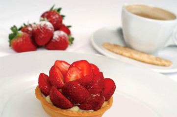 Awesome delicious strawberry pie and coffee on the table