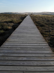 Wooden path to beach in galicia spain