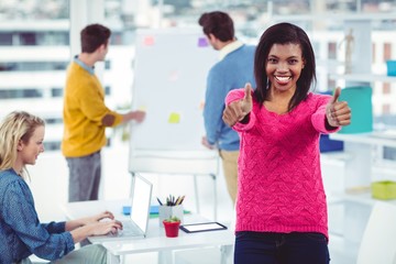 Smiling businesswoman near her colleagues