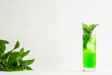 Green cocktail with mint on the white background
