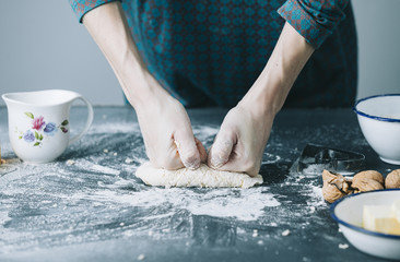 table with cookie cutter flour and various ingredients