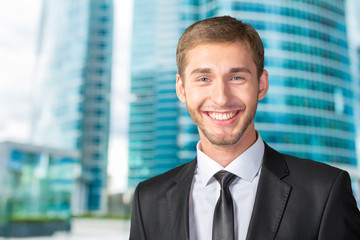 Young handsome businessman smiling