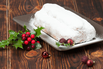 Stollen. Traditional Christmas Marzipan Pie. Decorations. Wooden