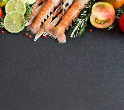 Raw langoustines with vegetables and herbs