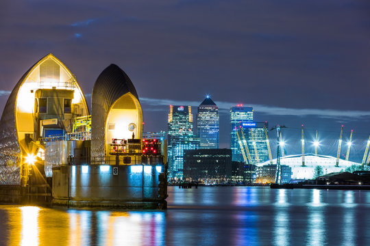 Thames Barrier, Millennium Dome (O2 Arena) And Canary Wharf At Night, London