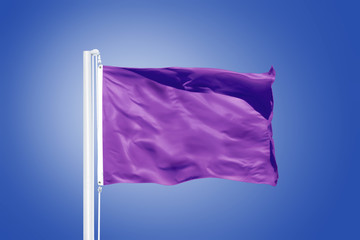 Purple flag flying against clear blue sky