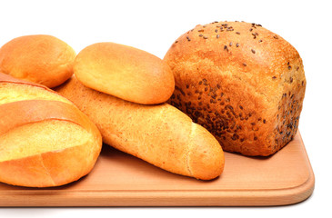 Bread on cutting board isolated on white