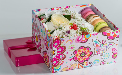Closeup of  Flowers and macaroon in the box (Shallow depth of fi