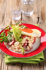 White beans with sausage and fried egg