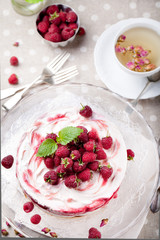 Raspberry, cheesecake with rose buds tea and fresh mint 