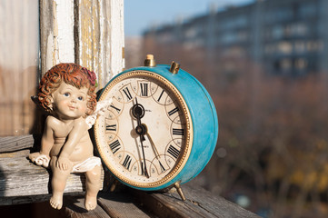 Retro angel girl and vintage clocks