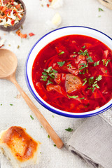 Traditional Ukrainian Russian vegetable soup, borsch with garlic donuts, pampushki.