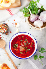 Traditional Ukrainian Russian vegetable soup, borsch with garlic donuts, pampushki.