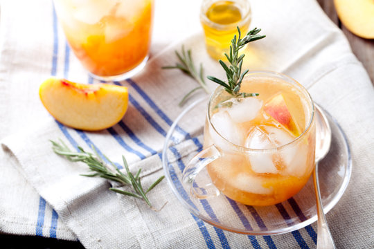 Peach And Rosemary Fizz Cocktail On A Wooden Background. Cocktail.