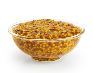 Bowl with french mustard isolated on white background.