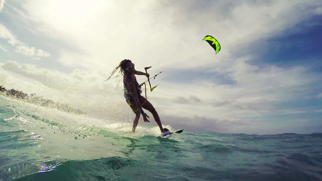 Summer Action Sports. Young Woman Kitesurfing. Fun in the Ocean. Healthy Active Lifestyle. 