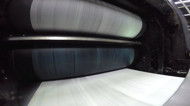 Newspapers print line in a factory close 