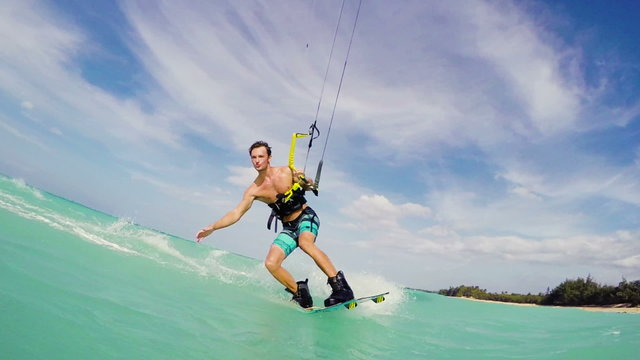 Young Man Kitesurfing in Ocean. Extreme Summer Sports HD. Slow Motion.