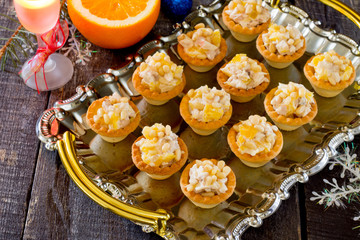 Tartlets with chicken on the eve of the New Year, selective focu