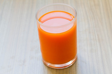 Healthy carrot juice cool drink on the wooden table