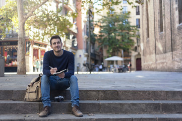 Fototapeta premium Young man taking photos in Barcelona