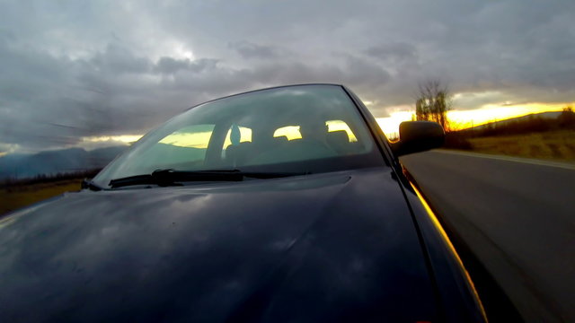 Driving a sport car, windshield reflection. Mounted 