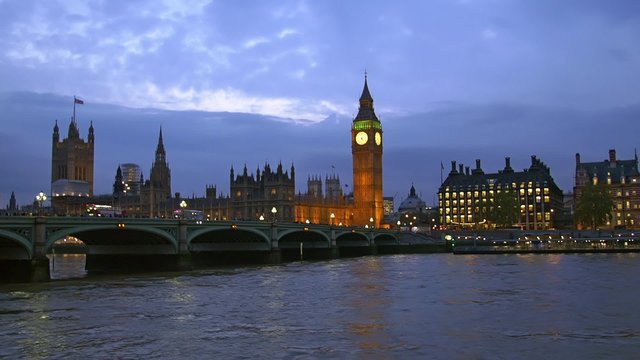View of the House of Parliament and the Big Ben in London after sunset, at dusk with artificial illumination