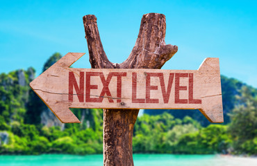 Next Level arrow with beach background